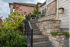 retaining wall and house hardscaping made with decorative stone veneer