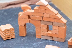 little toy house made of red bricks